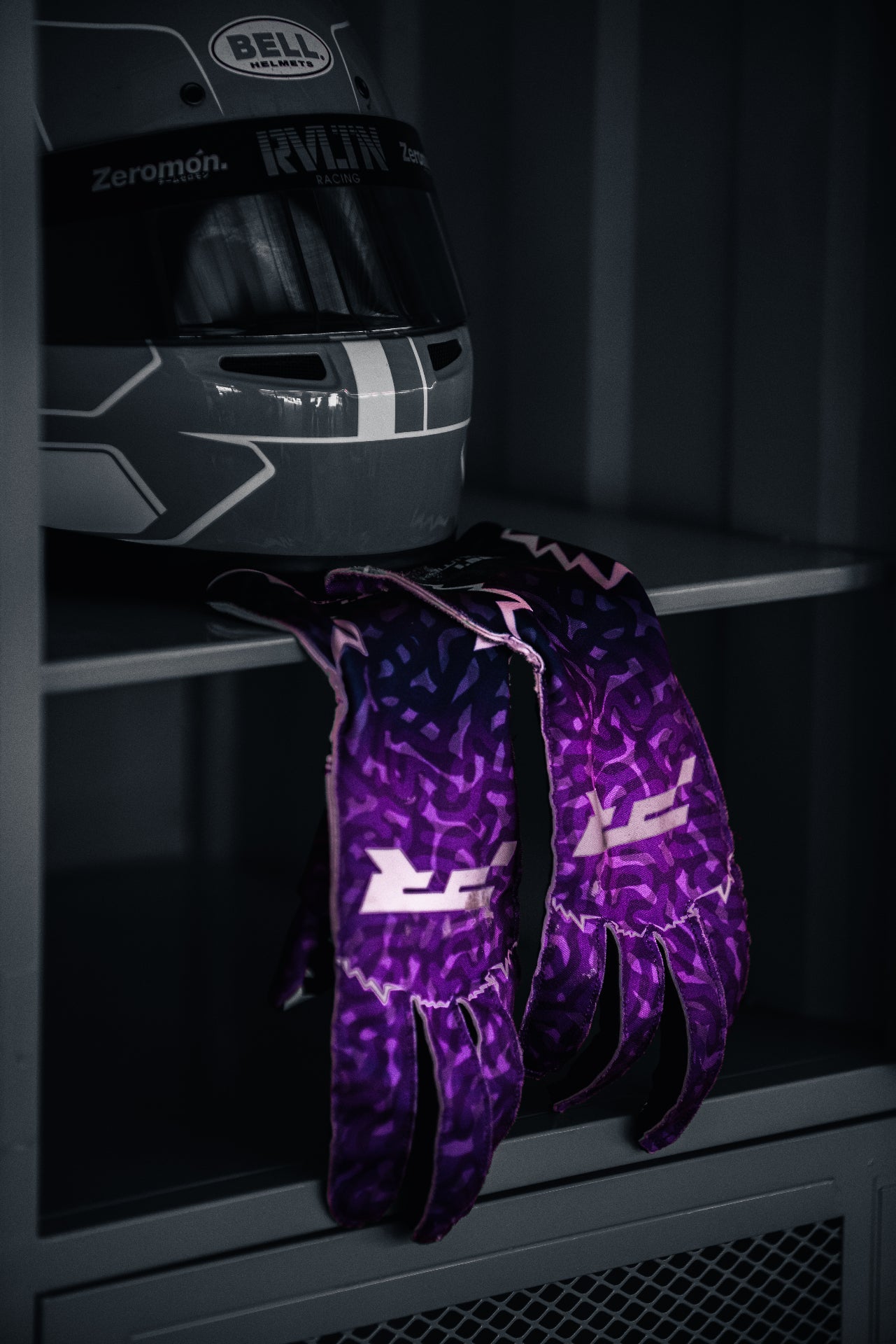 Project Revolution gloves resting beside a Bell helmet