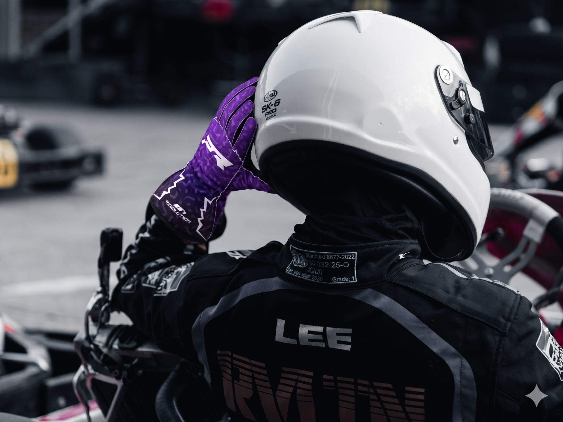 Project 001 — Driver in kart wearing purple Project Revolution gloves